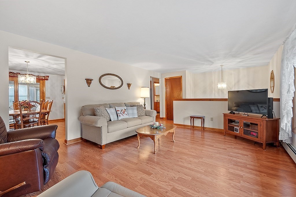 252 Great Road Shirley, MA 01464 - Photo 4 of 42 a living room with furniture and a flat screen tv