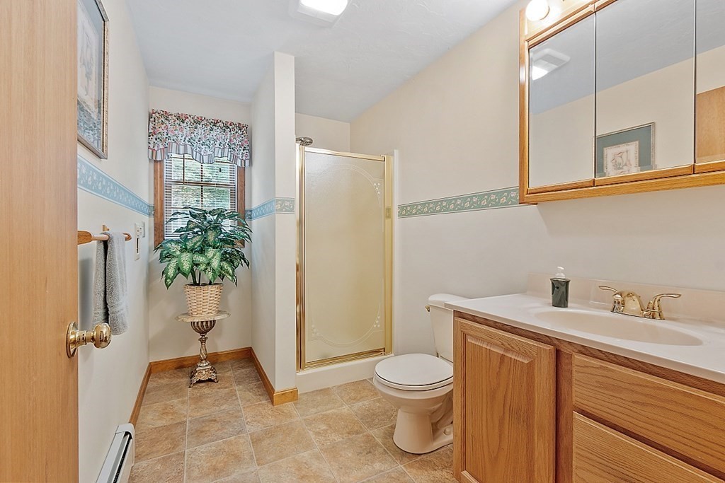 252 Great Road Shirley, MA 01464 - Photo 7 of 42 a bathroom with a toilet and a sink