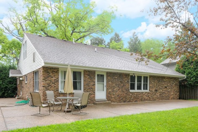 2463 Highmoor Road Highland Park, IL 60035 - Photo 1 of 15 a backyard of a house with table and chairs