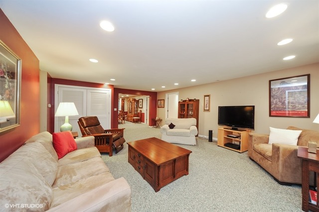 2463 Highmoor Road Highland Park, IL 60035 - Photo 3 of 15 a living room with furniture and a flat screen tv