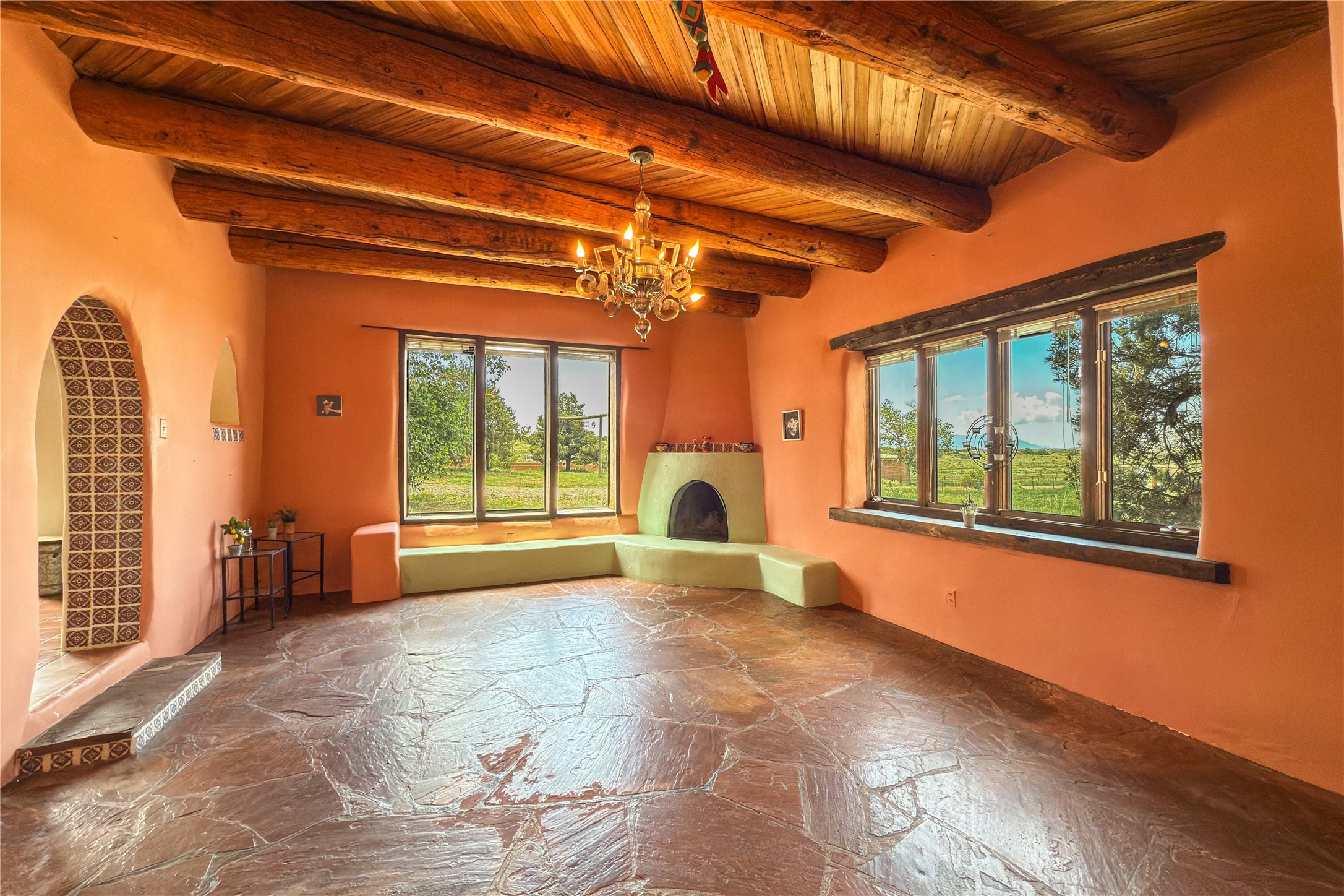 54 Rons Road Santa Fe, NM 87508 - Photo 5 of 99 LIVING ROOM WITH WOOD BURNING KIVA
