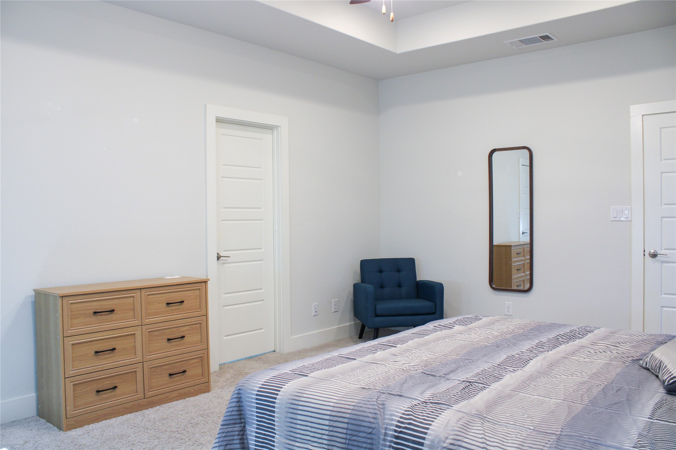 1007 Harwell Loop Kyle, TX 78640 - Photo 28 of 40 a bedroom with a bed and a dresser