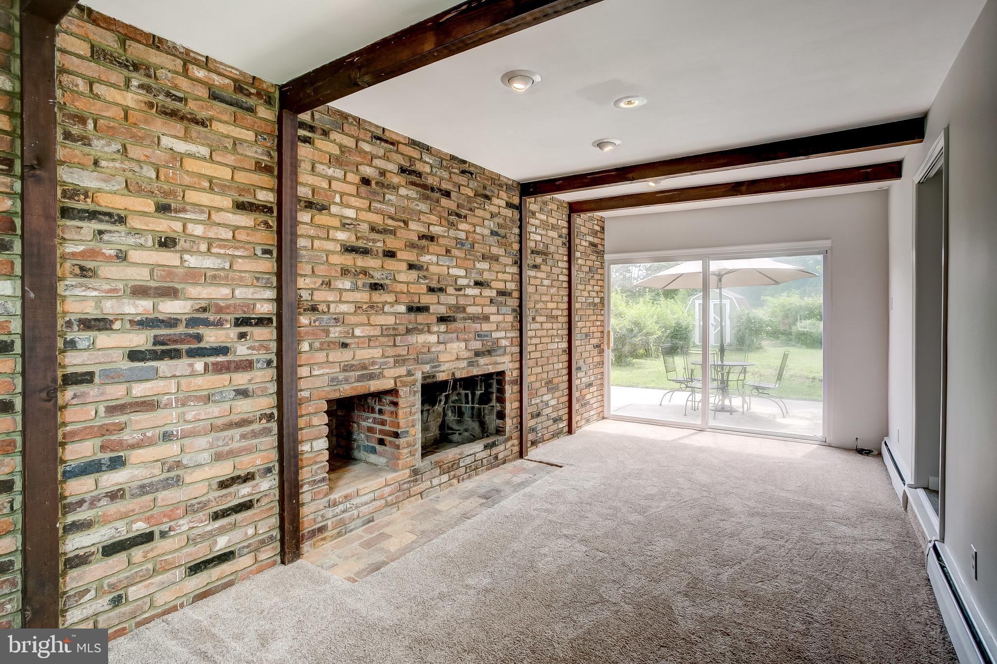 7008 Plymouth Road Baltimore, MD 21208 - Photo 16 of 43 Family room with unique brick focal point