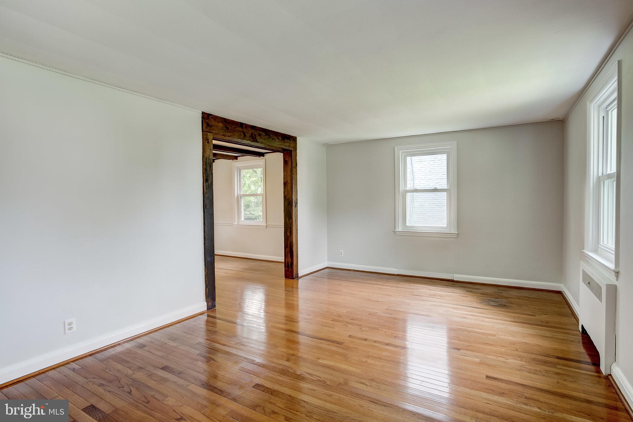 7008 Plymouth Road Baltimore, MD 21208 - Photo 7 of 43 Living room heading into dining room