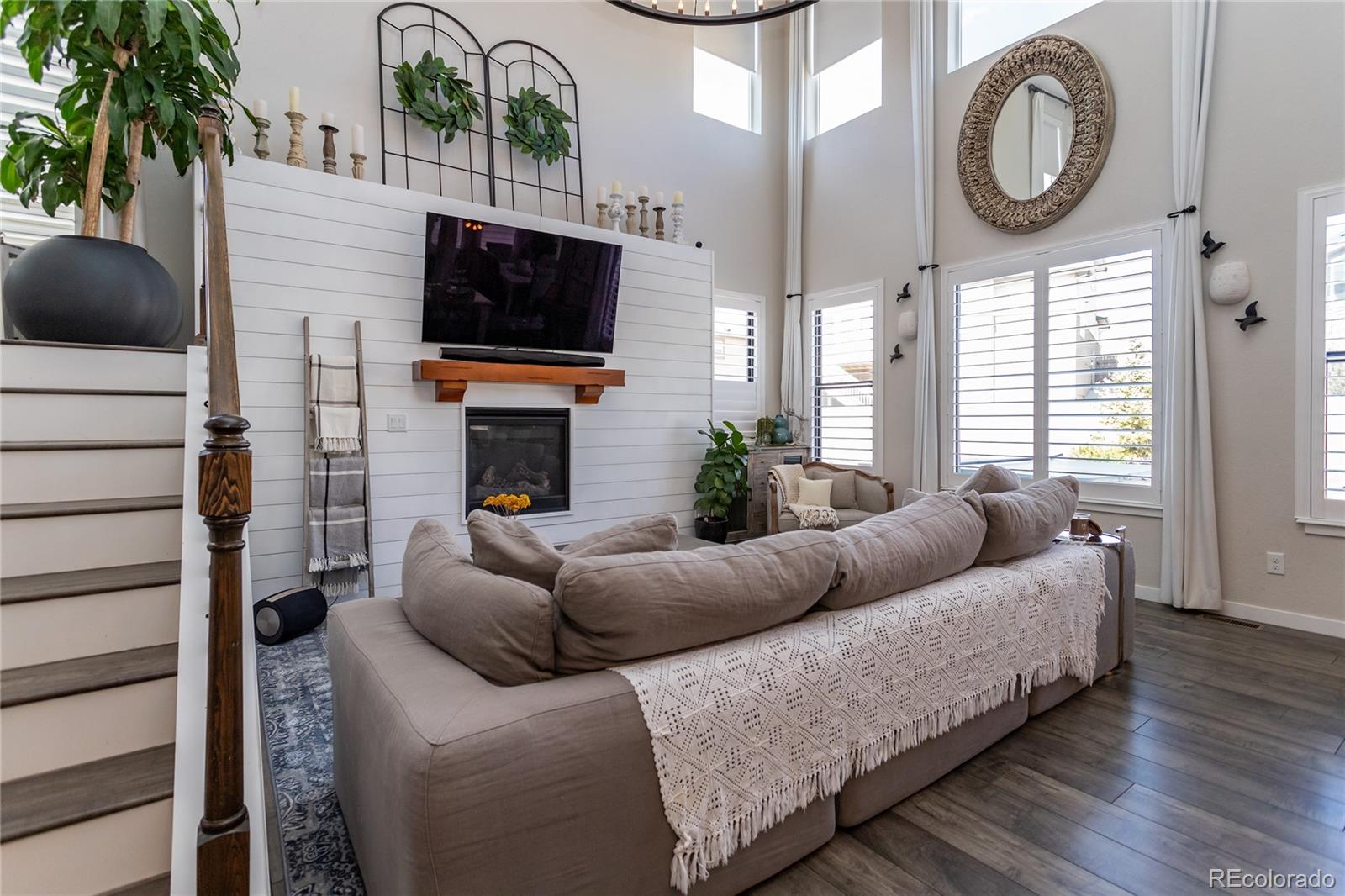 4208 Notch Trail Colorado Springs, CO 80924 - Photo 13 of 40 a living room with furniture a flat screen tv and a fireplace
