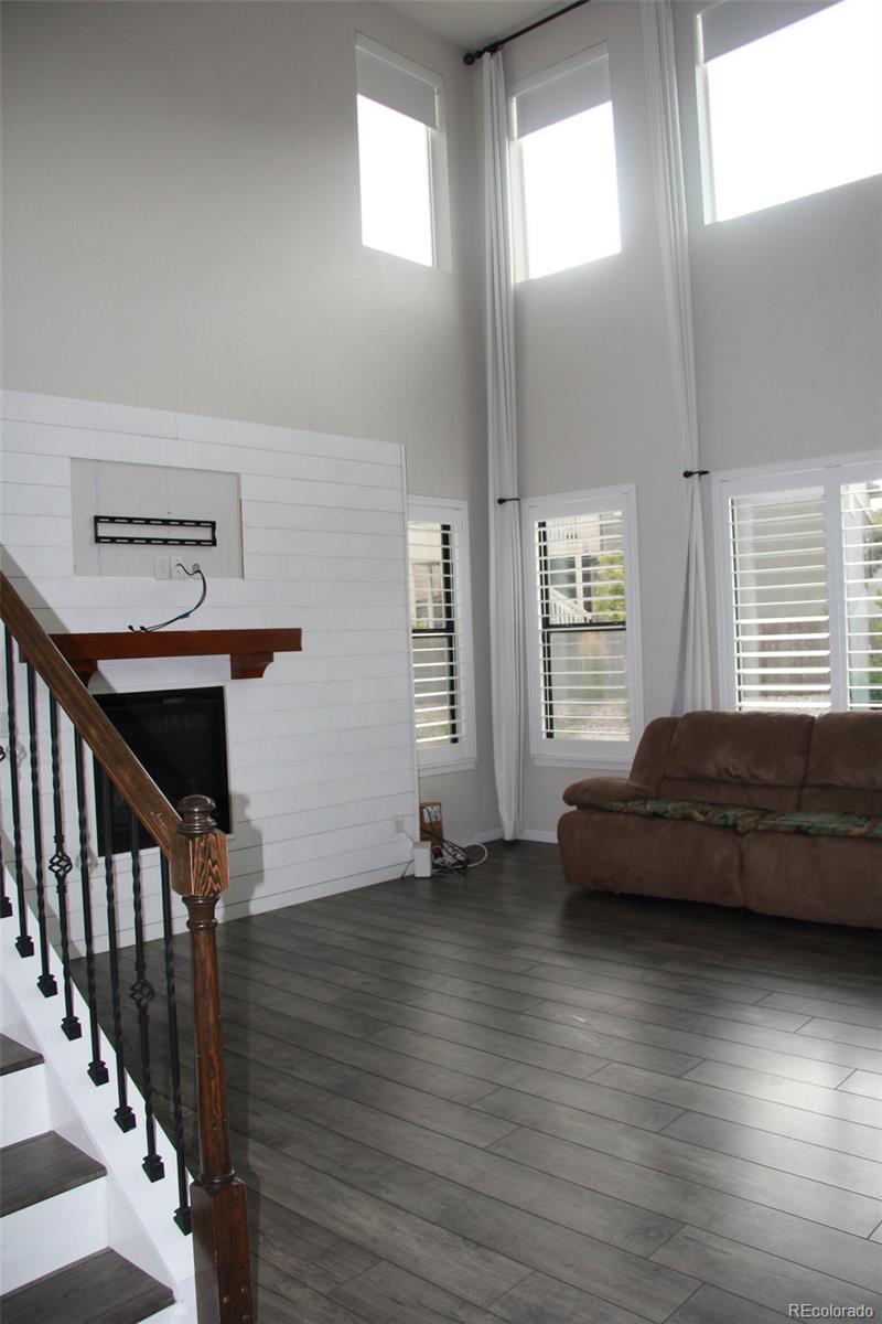 4208 Notch Trail Colorado Springs, CO 80924 - Photo 14 of 40 a view of hardwood floor and windows in a room