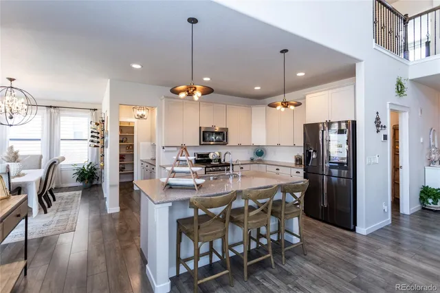 a kitchen with a stove and a microwave