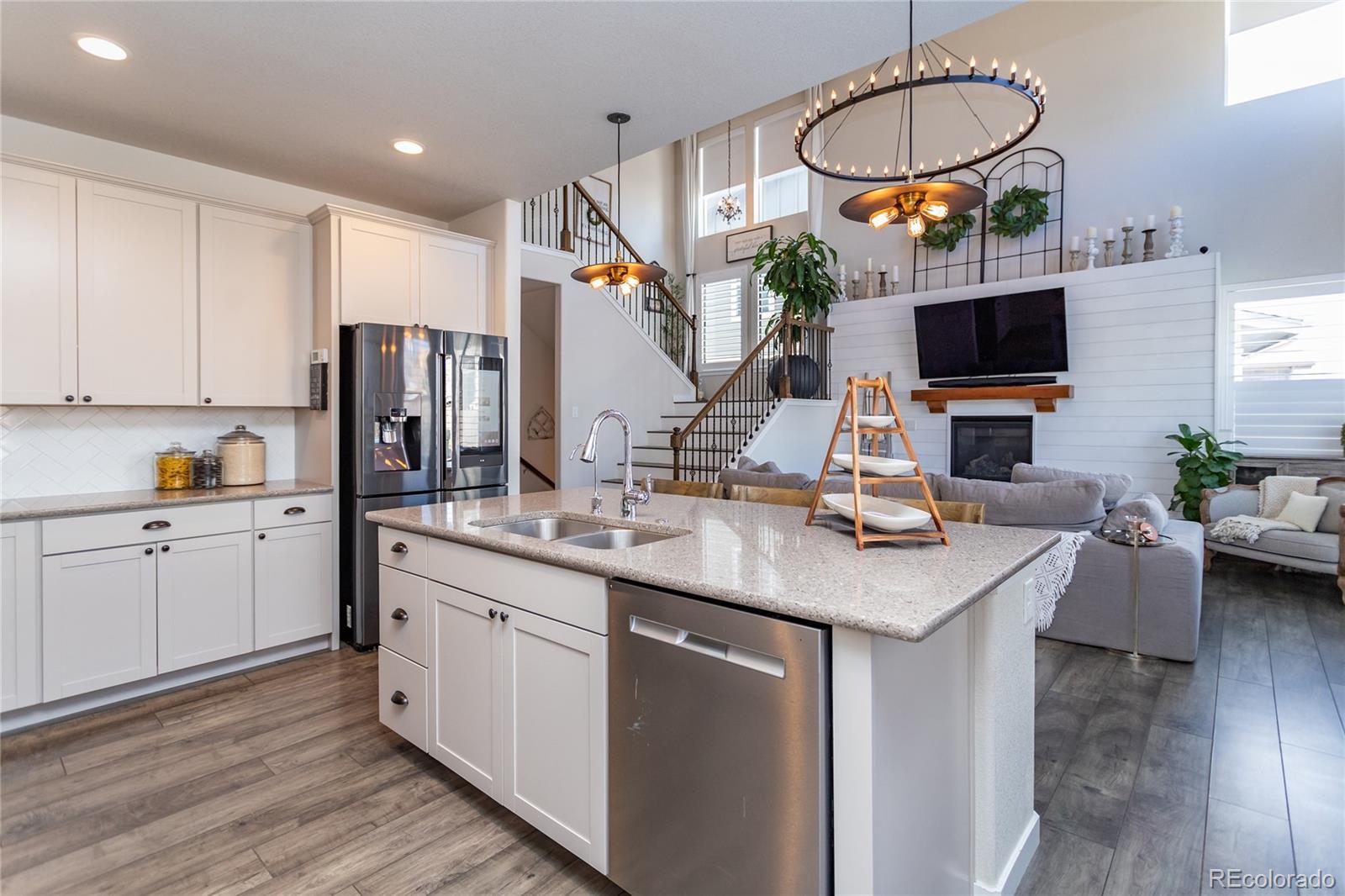 4208 Notch Trail Colorado Springs, CO 80924 - Photo 18 of 40 a kitchen with stainless steel appliances a sink stove and refrigerator