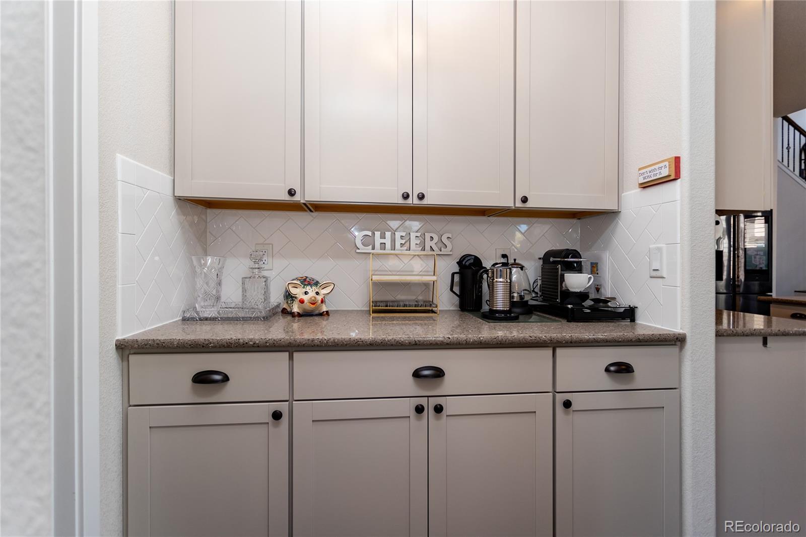 4208 Notch Trail Colorado Springs, CO 80924 - Photo 19 of 40 a kitchen with appliances cabinets and a counter top