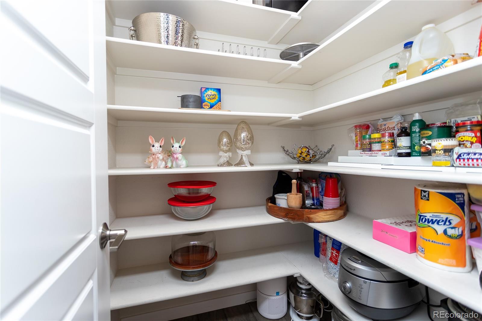4208 Notch Trail Colorado Springs, CO 80924 - Photo 20 of 40 a room with a fridge and shelves
