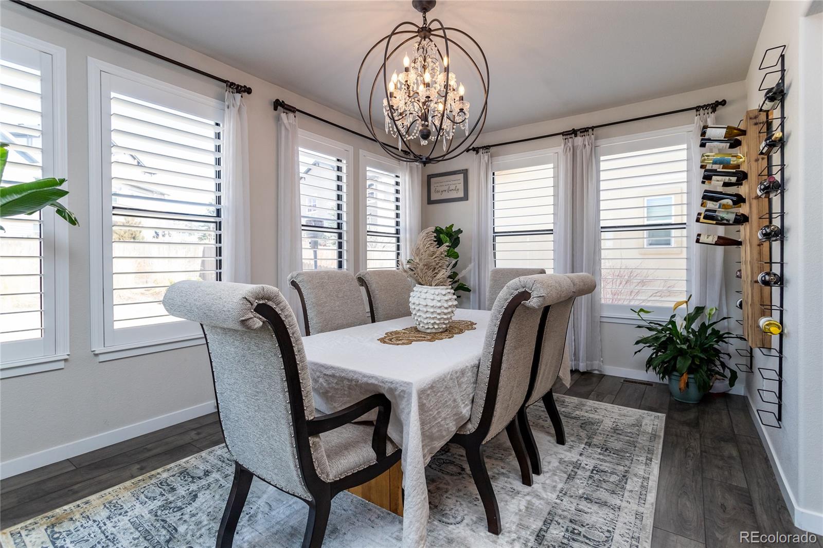 4208 Notch Trail Colorado Springs, CO 80924 - Photo 21 of 40 a view of a dining room with furniture window and wooden floor