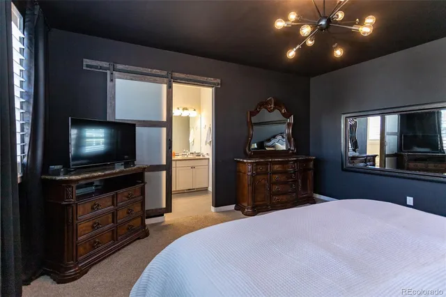 a bathroom with a shower and a sink