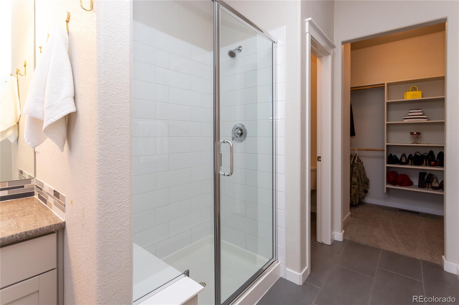 4208 Notch Trail Colorado Springs, CO 80924 - Photo 25 of 40 a bathroom with a shower and a sink