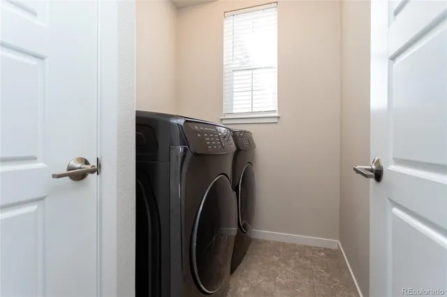 a bedroom with a bed and a potted plant