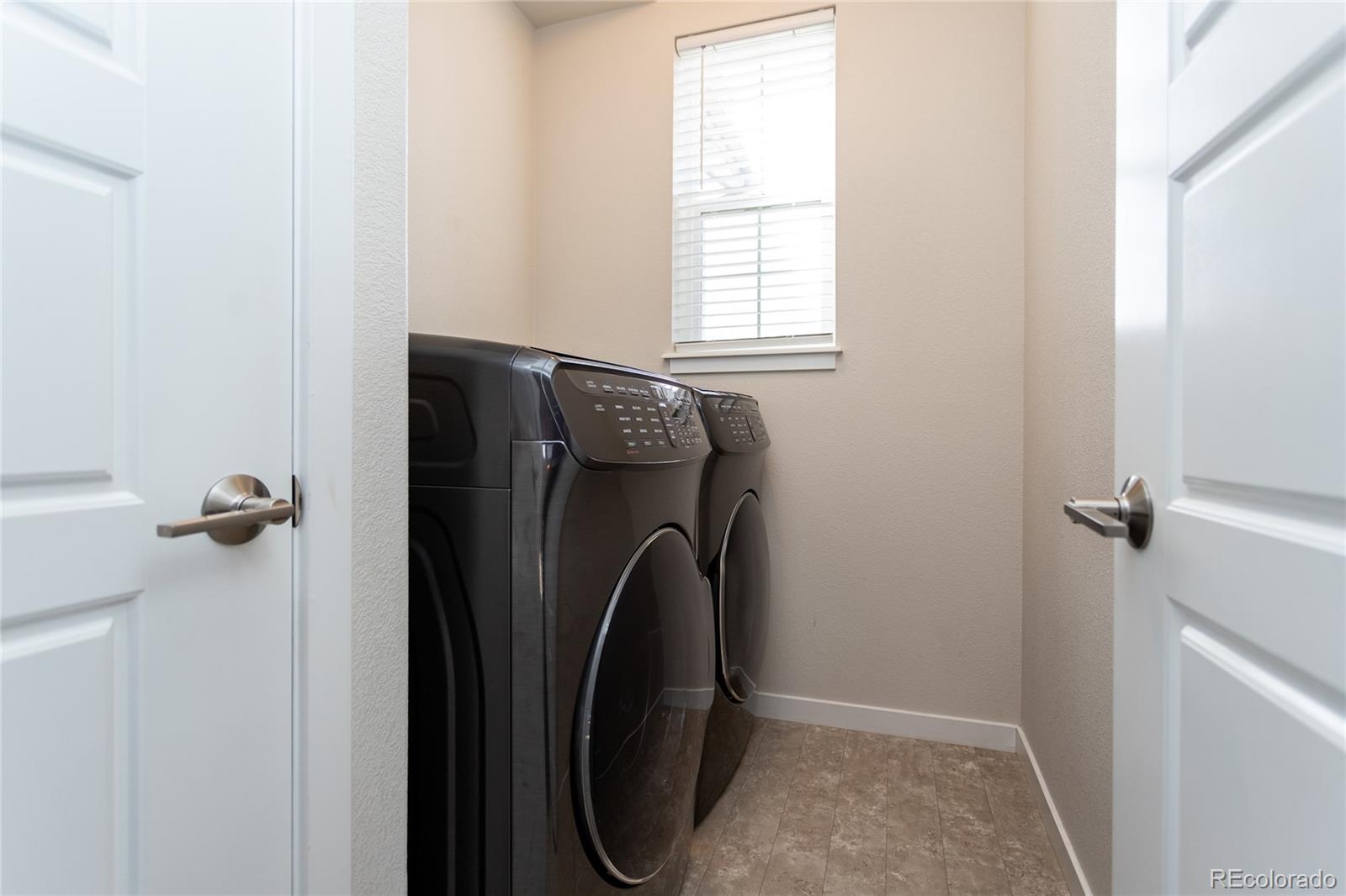 4208 Notch Trail Colorado Springs, CO 80924 - Photo 29 of 40 a utility room with dryer and washer