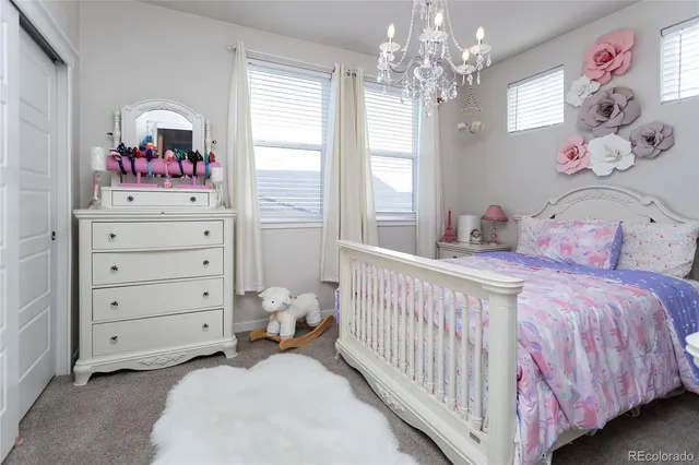 a bedroom with a bed and ceiling fan