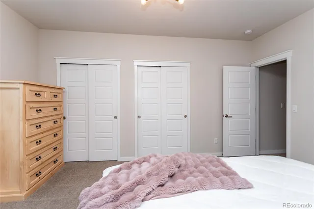 a living room with a couch and a chandelier