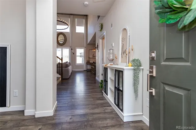 a view of entryway with wooden floor and stairs