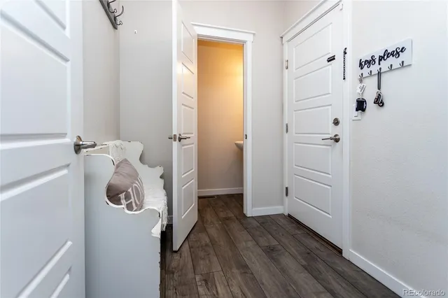 a living room with furniture a chandelier a rug and a window