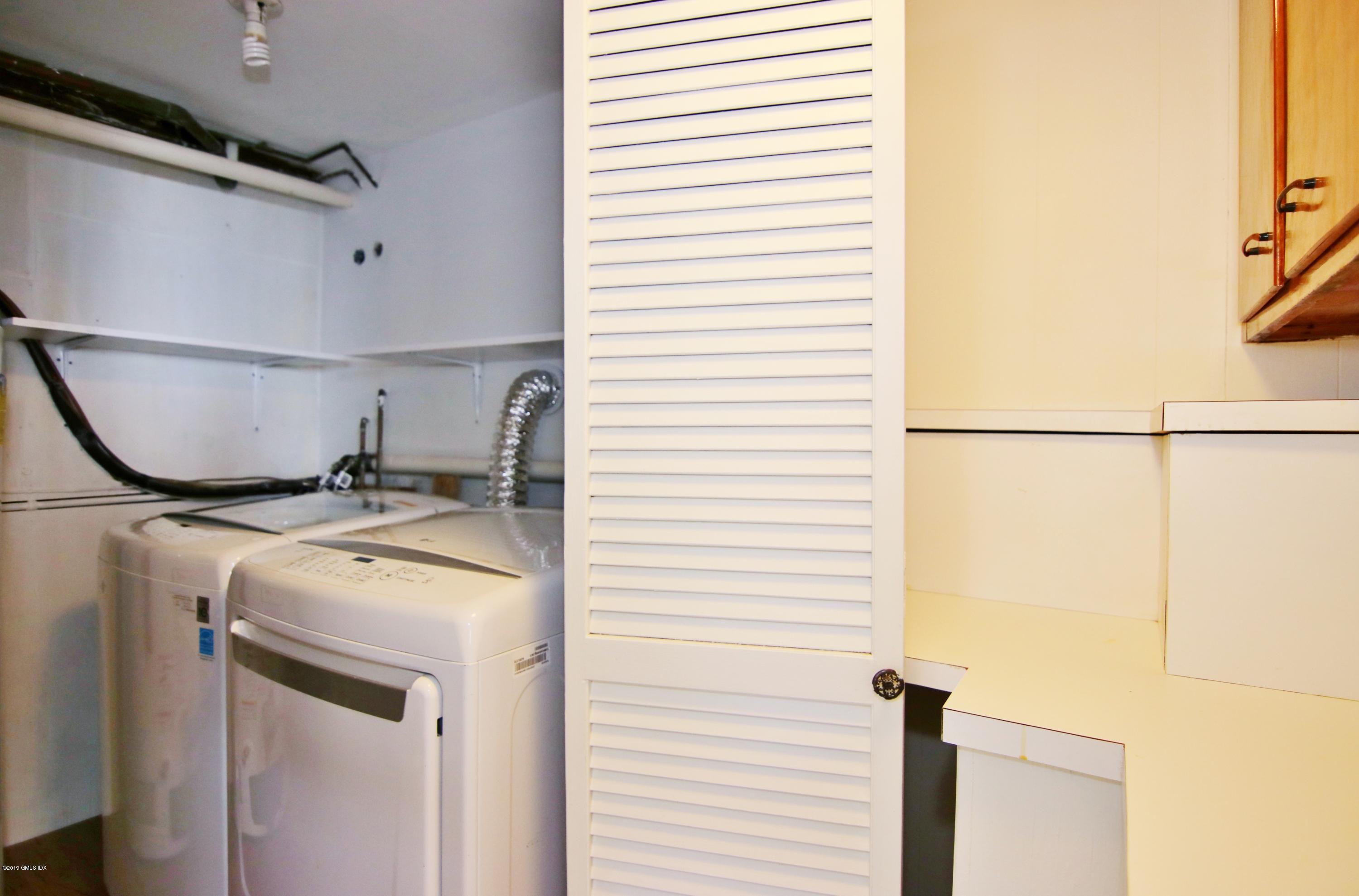 Undisclosed Address Riverside, CT 06878 - Photo 15 of 28 a utility room with dryer and washer