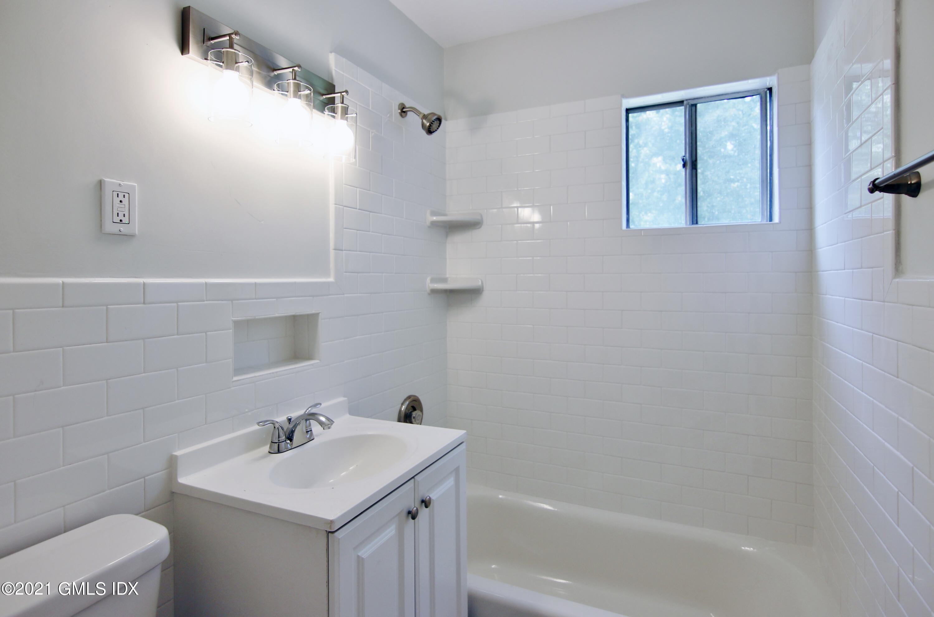 Undisclosed Address Riverside, CT 06878 - Photo 18 of 28 a bathroom with a sink a toilet and shower