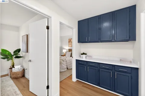 a kitchen with a sink and wooden cabinets