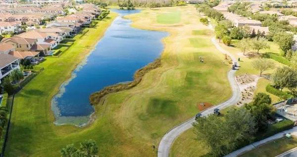 an aerial view of residential houses with yard