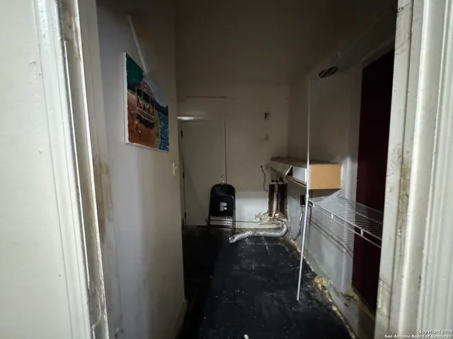 a view of living room with furniture and a window