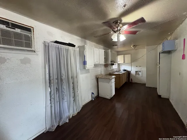 a kitchen with stainless steel appliances a refrigerator and a stove top oven