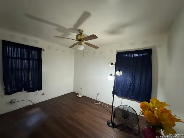 a room with a bed and a mirror