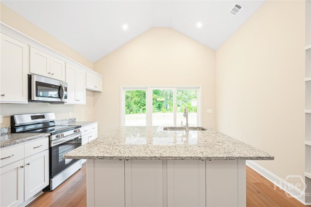 1138 Hanover Lane Townsend, GA 31331 - Photo 14 of 39 From the kitchen a slider leads to the patio.