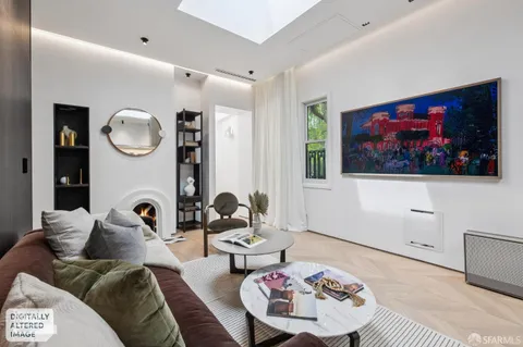 a living room with furniture and wall paintings