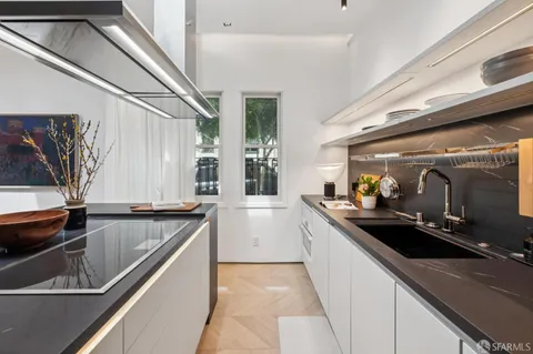 a kitchen with a sink and a stove