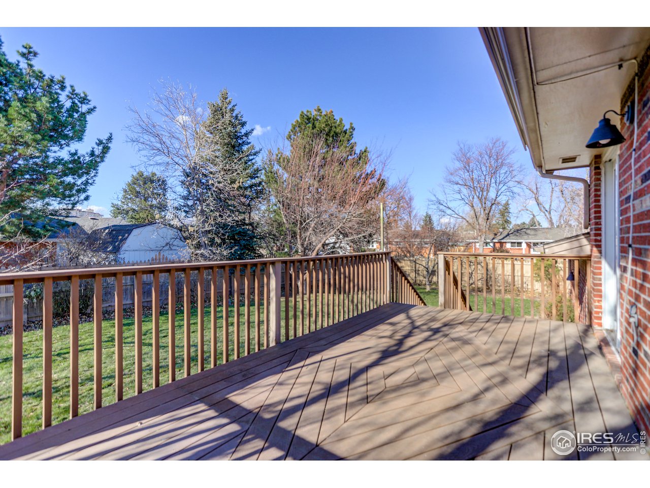 385 Manhattan Drive Boulder, CO 80303 - Photo 12 of 28 a view of balcony with wooden floor and fence