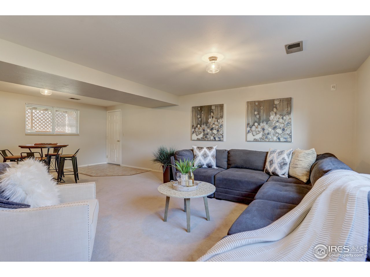385 Manhattan Drive Boulder, CO 80303 - Photo 18 of 28 a living room with furniture and a wooden floor