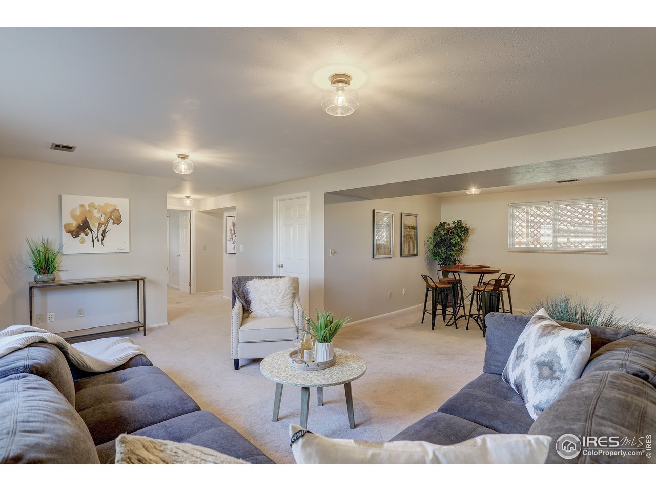 385 Manhattan Drive Boulder, CO 80303 - Photo 19 of 28 a living room with furniture and wooden floor