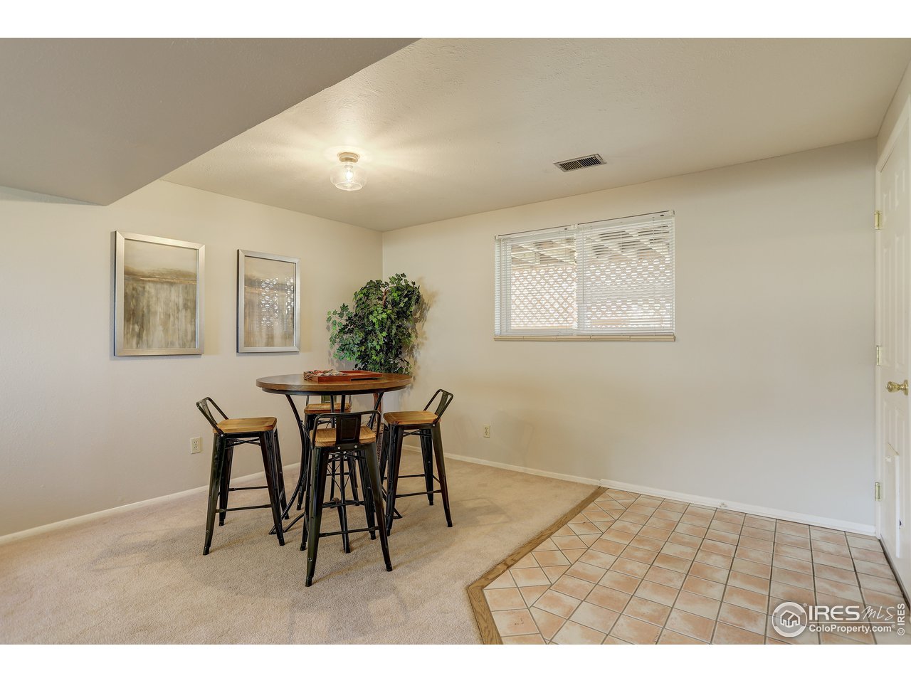 385 Manhattan Drive Boulder, CO 80303 - Photo 20 of 28 a dining room with a wooden table and chairs