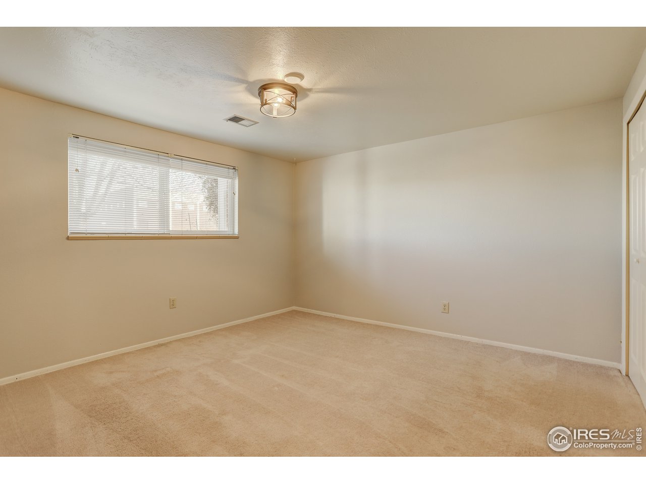 385 Manhattan Drive Boulder, CO 80303 - Photo 21 of 28 a view of an empty room with a window