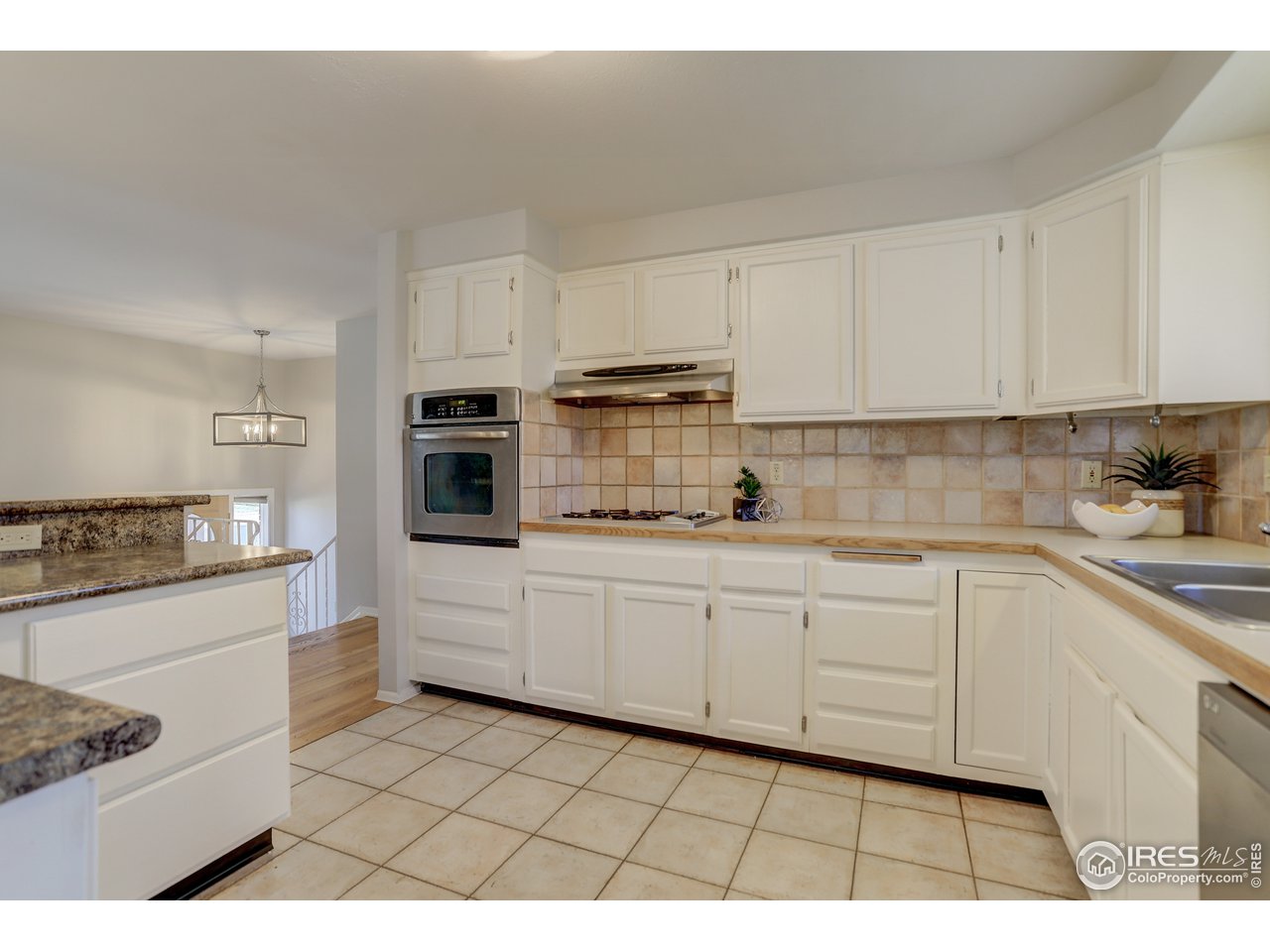 385 Manhattan Drive Boulder, CO 80303 - Photo 8 of 28 a kitchen with cabinets and appliances