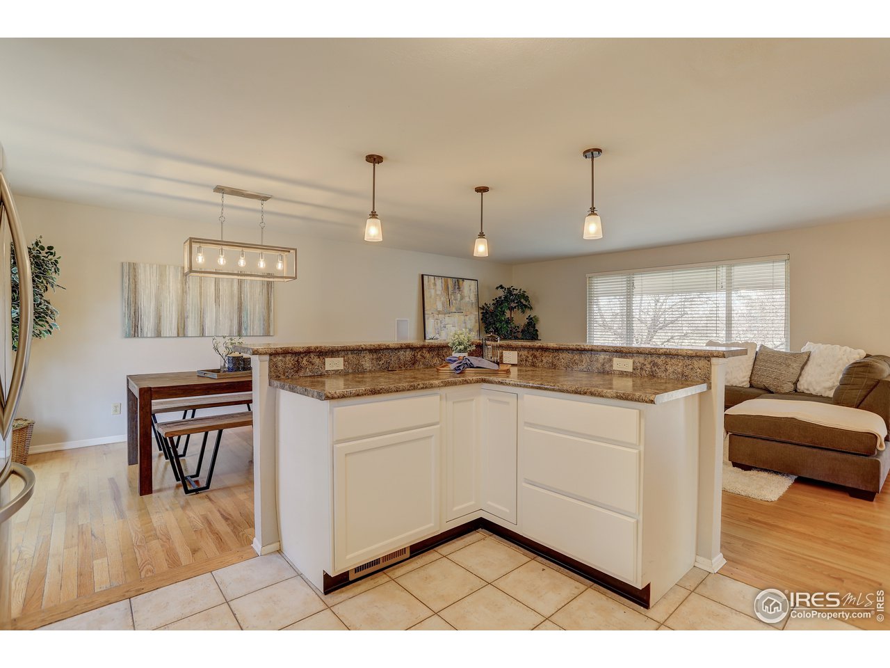 385 Manhattan Drive Boulder, CO 80303 - Photo 9 of 28 a large white kitchen with a sink and dishwasher a stove with wooden floor