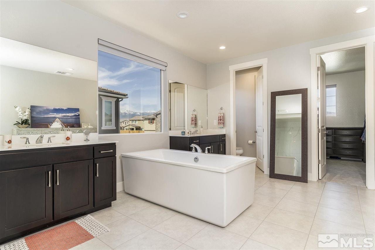 9272 Red Spring Drive Reno, NV 89521 - Photo 11 of 25 a bathroom with a sink mirror and a bathtub