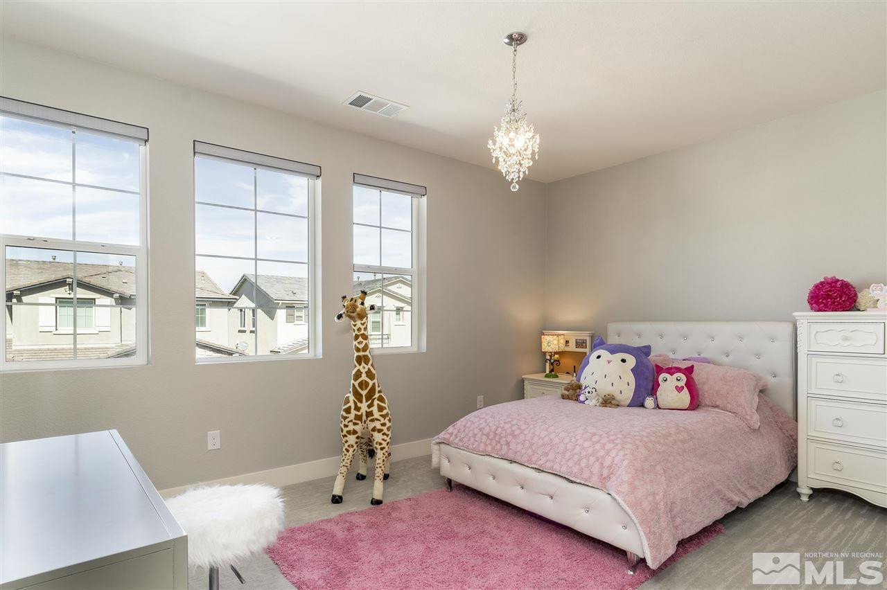 9272 Red Spring Drive Reno, NV 89521 - Photo 13 of 25 a bedroom with a bed and window