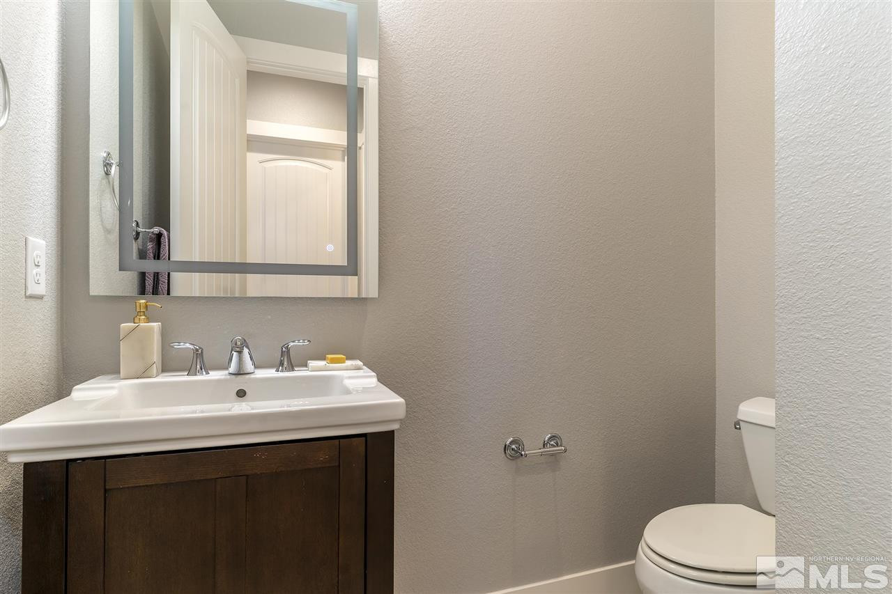 9272 Red Spring Drive Reno, NV 89521 - Photo 20 of 25 a bathroom with a sink mirror and toilet