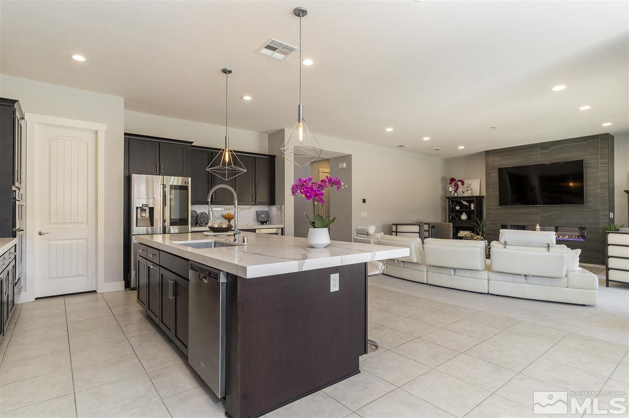9272 Red Spring Drive Reno, NV 89521 - Photo 6 of 25 a kitchen with kitchen island a sink stove top oven and refrigerator