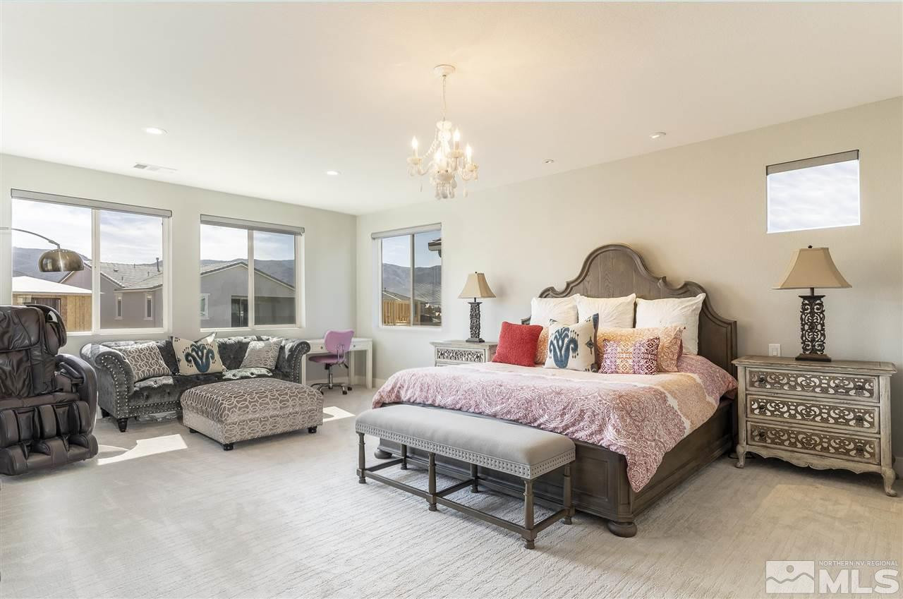 9272 Red Spring Drive Reno, NV 89521 - Photo 10 of 25 a bedroom with a bed couch and large windows