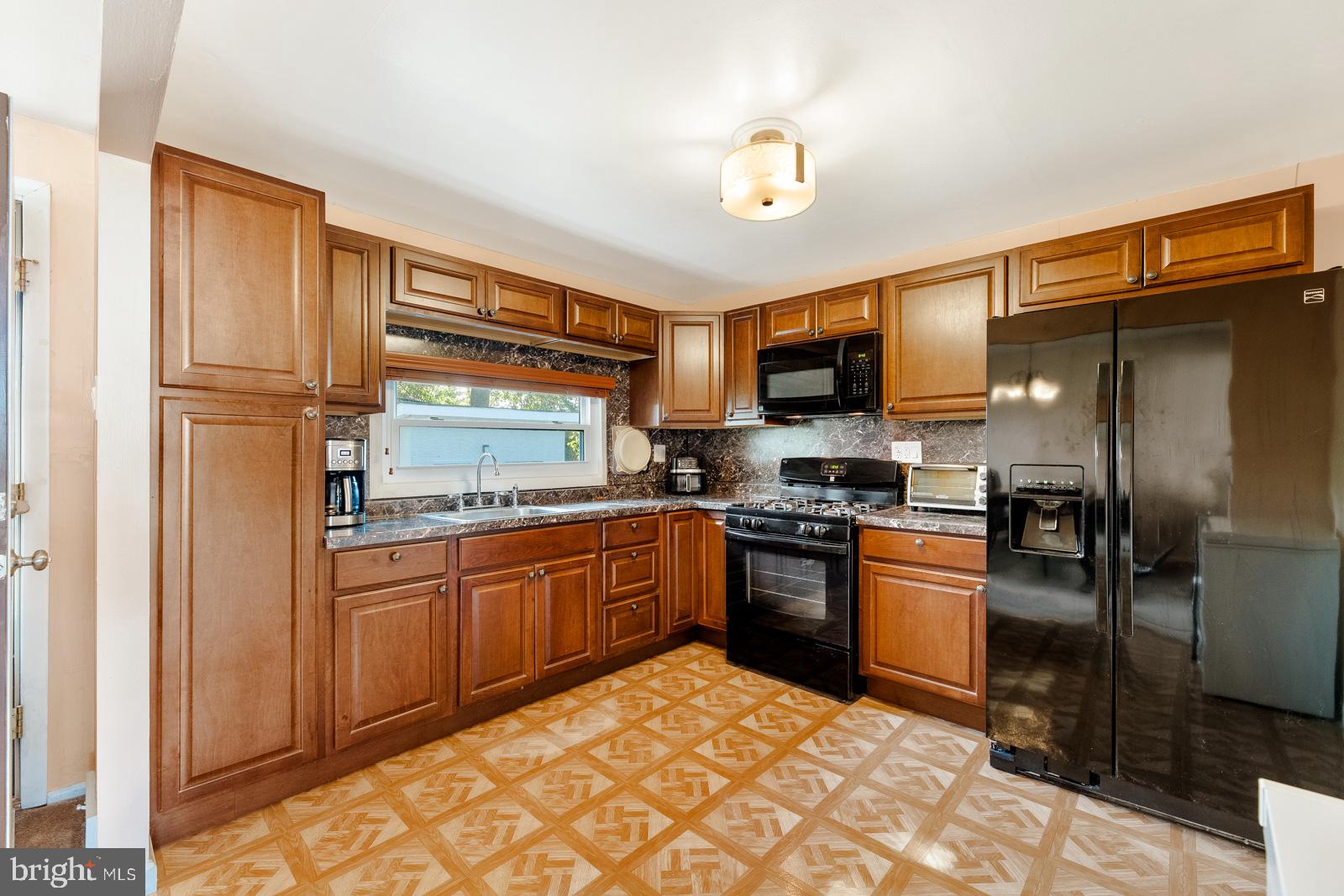 823 Rennard Street Philadelphia, PA 19116 - Photo 13 of 40 Charming kitchen with rich wood tones.