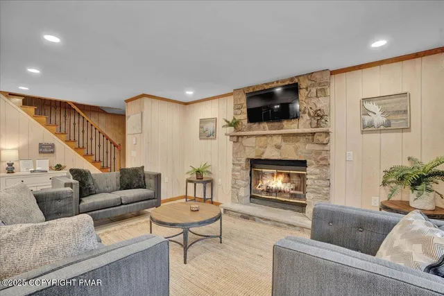 a living room with furniture and a washer dryer