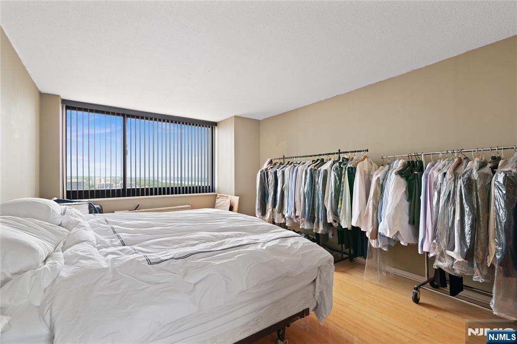 200 Old Palisade Road, Unit 21J Fort Lee, NJ 07024 - Photo 15 of 29 a bedroom with a bed and a window
