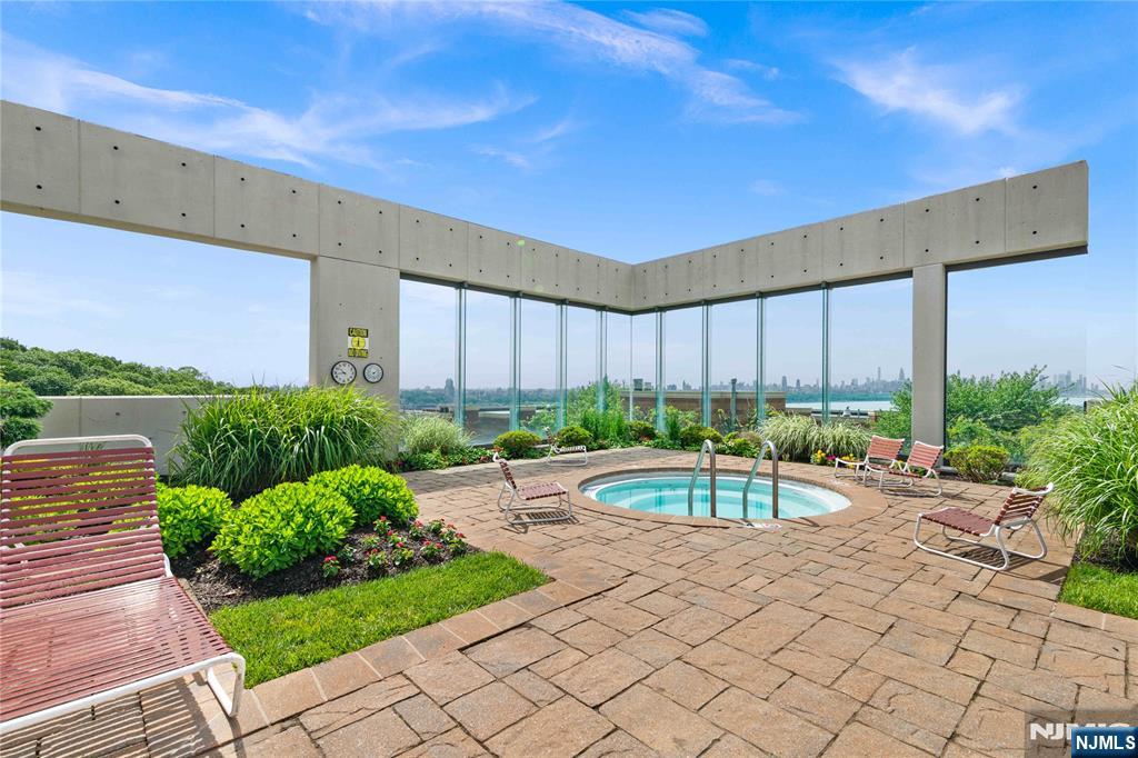 200 Old Palisade Road, Unit 21J Fort Lee, NJ 07024 - Photo 23 of 29 a couple of table and chair in the patio