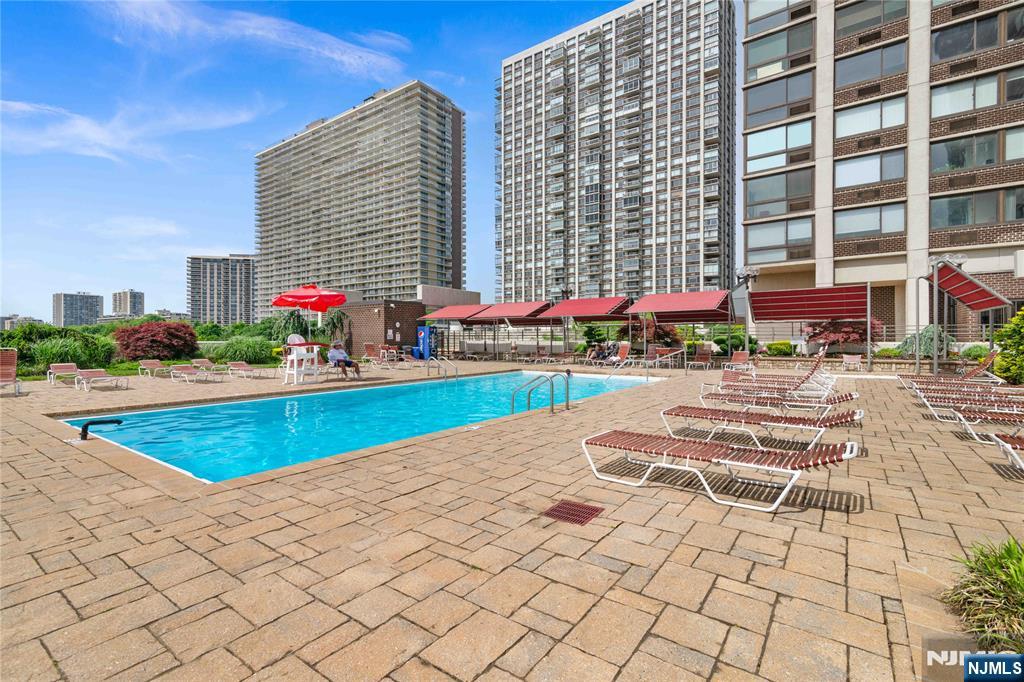 200 Old Palisade Road, Unit 21J Fort Lee, NJ 07024 - Photo 24 of 29 a view of pool with outdoor seating